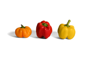 red , yellow ,orange peppers on white background