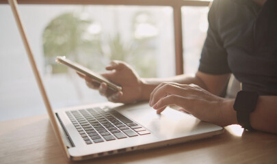 Hand input to smartphones and laptop.