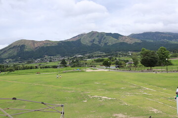Japan's active volcano Aso mountain range and grassland scenery