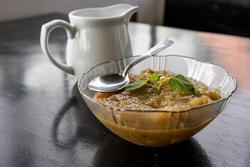 Milk Stewed Pumpkin, Peruvin dessert boiled sugar in white bowl. Chiuche con leche