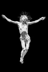 Fototapeta na wymiar Jesus Christ - Old crucifix, Catholic Church, on black background with copy space.