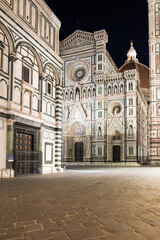 Italy, Florence by night. The  illuminated architecture of the cathedral exterior.
