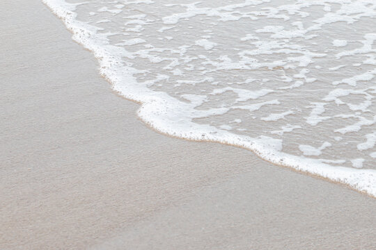 Soft waves on a beautiful beach in the evening.