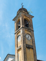 The bell tower of the old church of Saint Antnio Abate in the small ancient village Naggio, province of Como, Lombardy, Italy