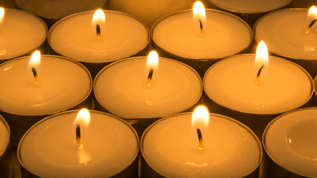 Burning candles in full screen, Several lit candles