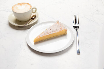 orange tart and coffee latte