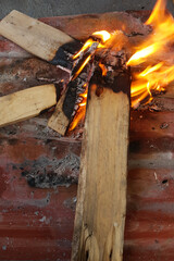 Vertical close up on burning wood or lumber