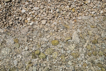 Pebbles washed by wave at Paxos island during summer