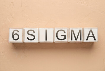 Cubes with text 6 SIGMA on color background