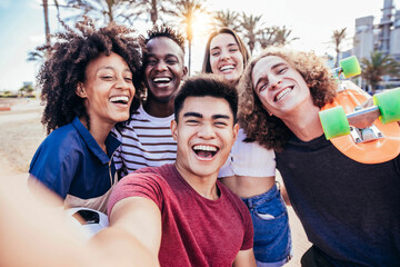 Multiracial friends taking selfie outside on summer vacation - Young people having fun hanging out...
