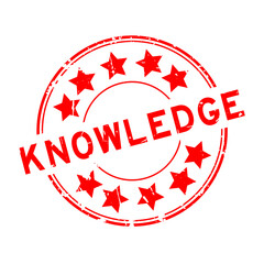 Grunge red knowledge word with star icon round rubber seal stamp on white background