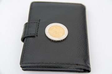 2 Euro-coin lying on a wallet