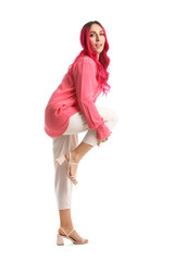 Beautiful woman with bright pink hair on white background