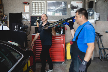 Replacement of car glass in a car service.