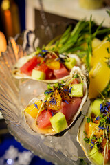 Tuna ceviche in a shell on the festive table