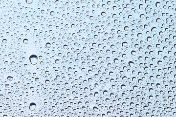 drops glass blue background abstract, transparent cold background water splashes