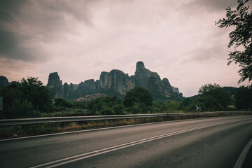 Fototapeta na wymiar The iconic rocks of Meteora in Greece as seen from a rural road