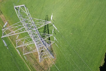 High voltage power line against a blue sky