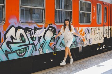 a women goes on the graffiti train at the railway station in varna bulgaria 