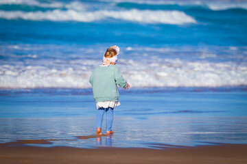 little child playing on the beach in Portual Lagos Algarve