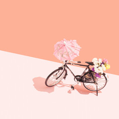 Creative composition of vintage bicycle with field flowers. Retro romantic idea.