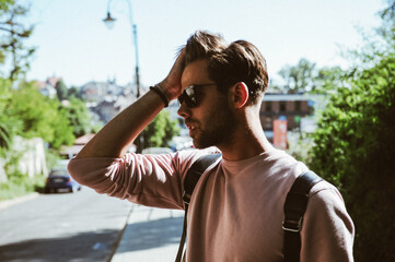 Man in pink sweater eat