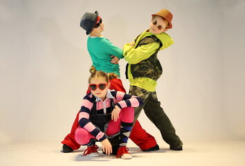 Fototapeta na wymiar Happy kids, hip hop group of children, kids in sunglasses,boys and girl, street style, hip hop style, colourful clothes, dancers, 