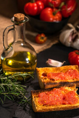 Traditional Spanish appetiser - "Pan Tomaca" (bread with tomato) toasted bread with garlic topped with freshly squeezed tomato and virgin olive oil.