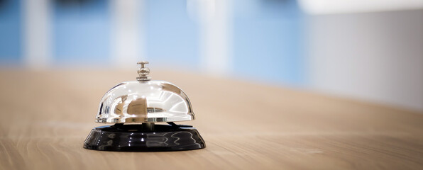Metal service bells on wooden floor Service concept and customer assistance.