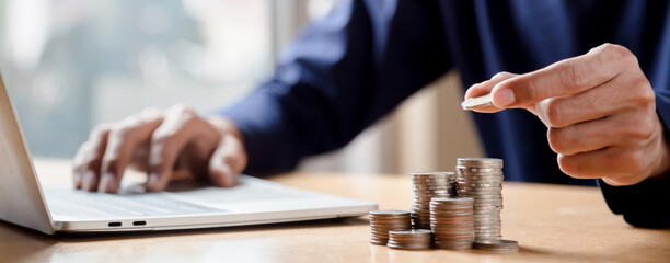 Man hands putting coins stack, Concept business finance saving money and investment.