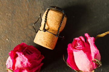 Wine cork and dry roses