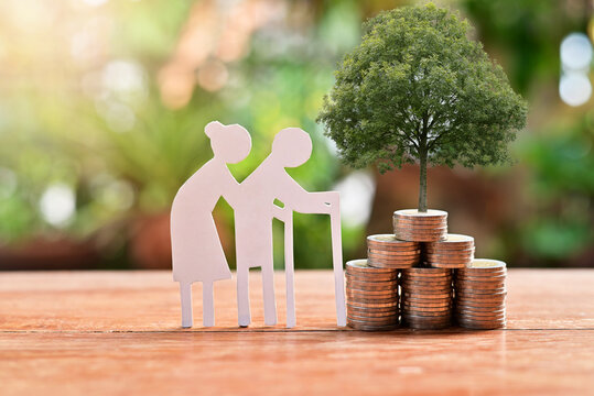 old couple model set with money coins saving for concept investment mutual fund finance and pension retirement
