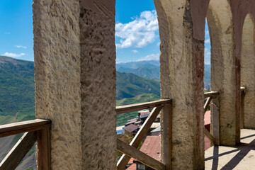 arched gallery along the facade of the house in the ancient mountain village of Chokh in Dagestan