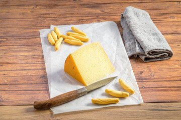 Cheese, breadsticks and kerosene wax paper
