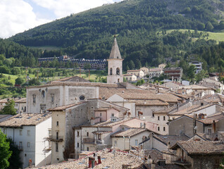 Fototapeta na wymiar Pescocostanzo - Abruzzo - One of the most beautiful tourist villages in Italy - In the background stands the majestic bell tower of the mother church