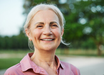 woman outdoor senior happy retirement elderly portrait female active park smiling old fun nature...