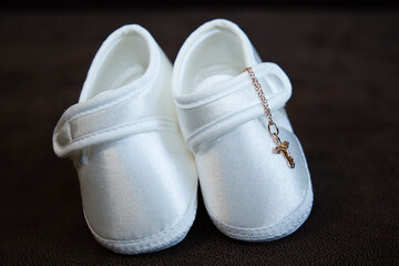 clothes of a child for the sacrament of baptism, children's clothes, a cross,