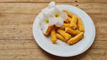 Crunchy Cheese Sticks Or Kastengel Cookies Indonesian Food With White Flower
