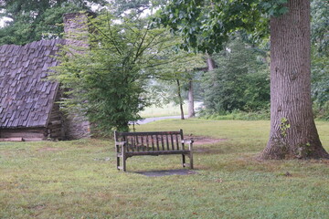 Bench Between Two Trees Behind Log Cabin at Valley Forge Park