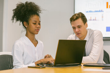 Obraz premium Diverse colleagues gather in brainstorm discuss statistics together. Group of people colleagues gather doing Brainstorming business plan together. Team Brainstorm Working Concept.