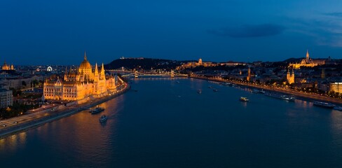 Fototapeta na wymiar Budapest by night - panorama drone photo of Budapest, Hungary, river Danube, the Parliament, Chainbridge and the Buda Castle and Royal Palace.