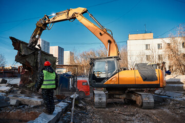 Excavator destroyer removes debris under worker control