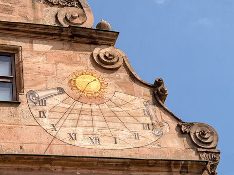 NUREMBURG, GERMANY - JULY 10, 2019:  The facade of City Museum at Fembo House with colourful a sun dial