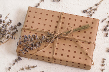Handmade gift box in craft packaging, dry lavender. Floristic, herbarium craft, zero waste. Natural...