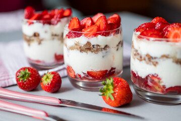 delicious homemade dessert with cream and strawberries in a glass