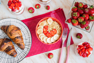 delicious oatmeal with homemade dessert with cream and strawberries in a glass