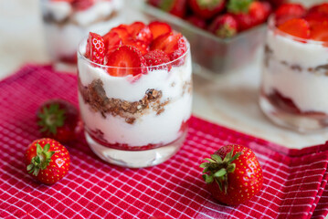 delicious homemade dessert with cream and strawberries in a glass
