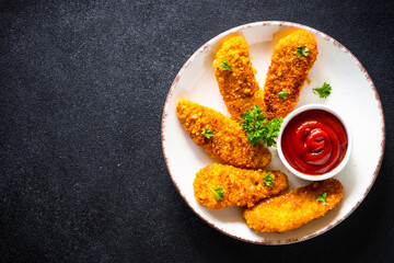 Chicken nuggets with ketchup sauce. Top view image with copy space,