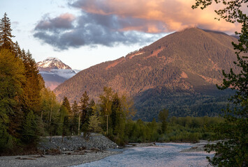 Picture of the Chilliwack river and surrounding mountains in beautiful evening light taken from the Vedder bridge in Chilliwack British Columbia Canada