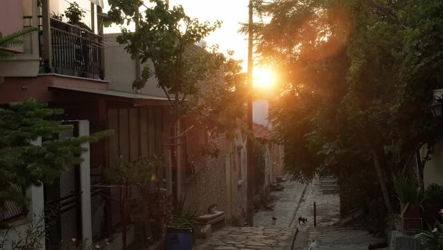 Old city picturesque Greek street at sunset.